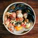 white and brown sea shells in white ceramic bowl